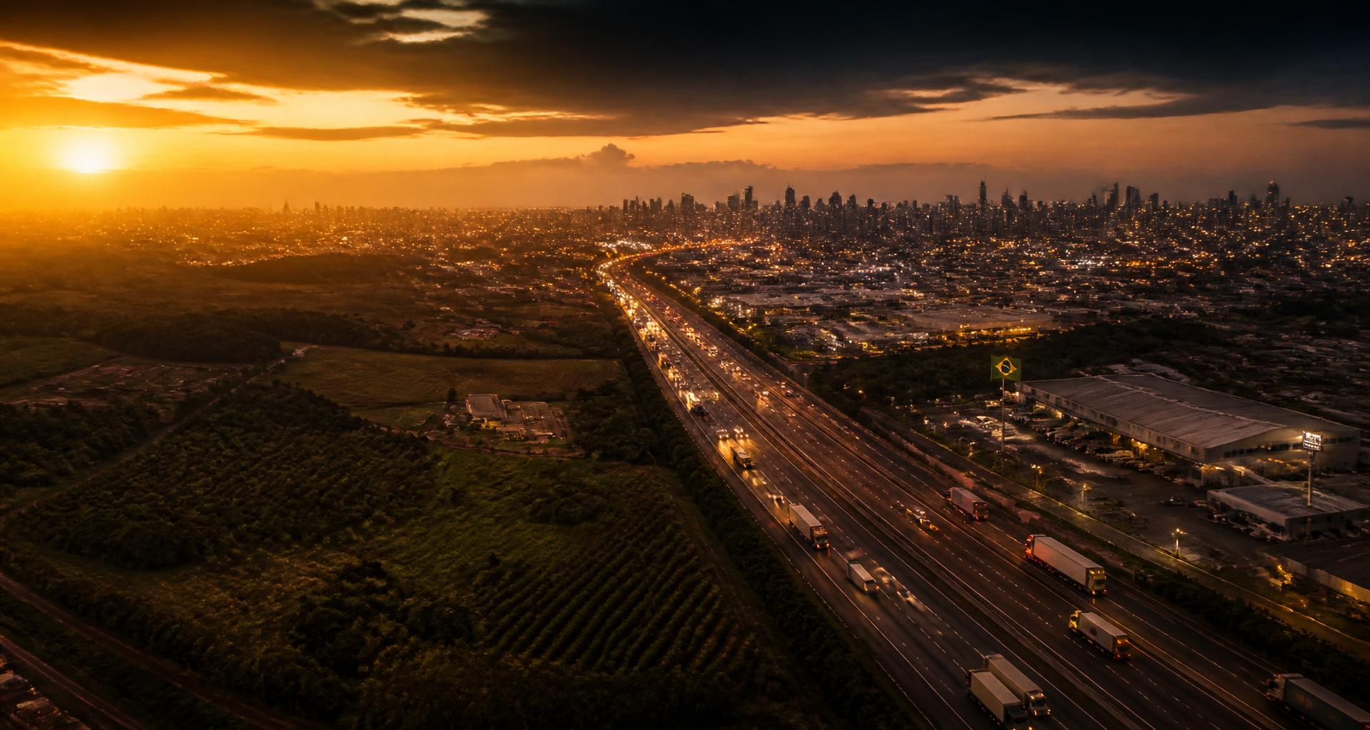 Vista panorâmica do Brasil em movimento — rodovia, cidade e horizonte ao entardecer